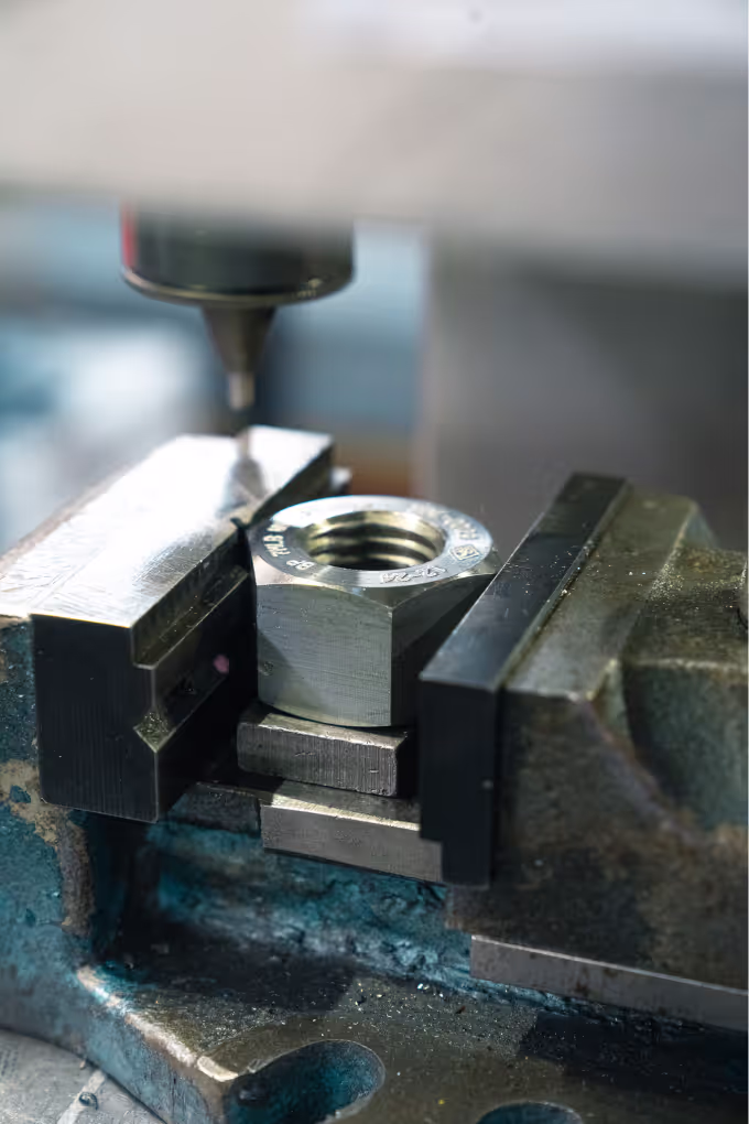 A bolt being drilled