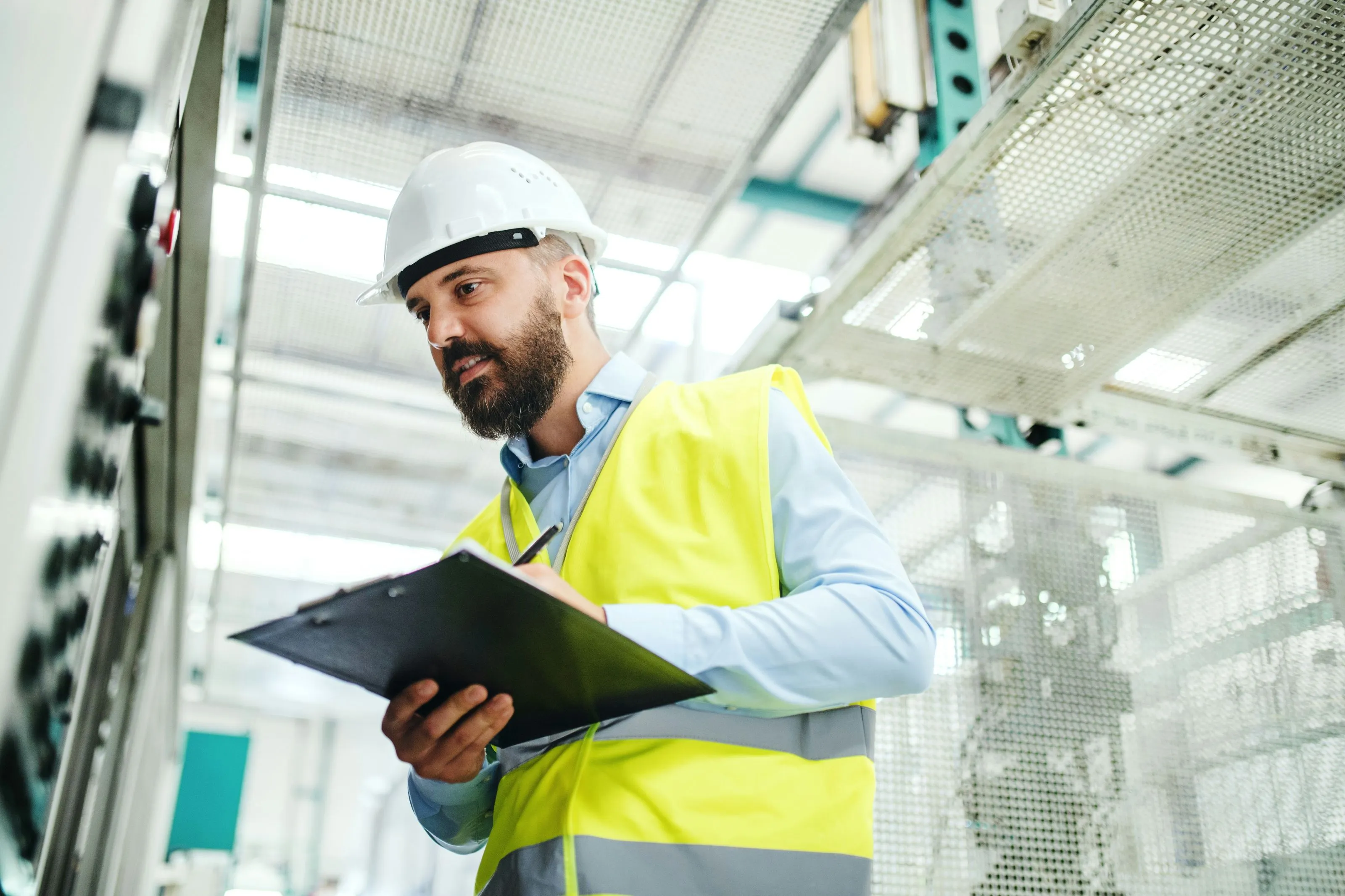 man with hard hat and clipboard